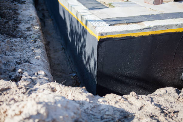 Professional Emergency Waterproofing technician working in Frankfort, MI